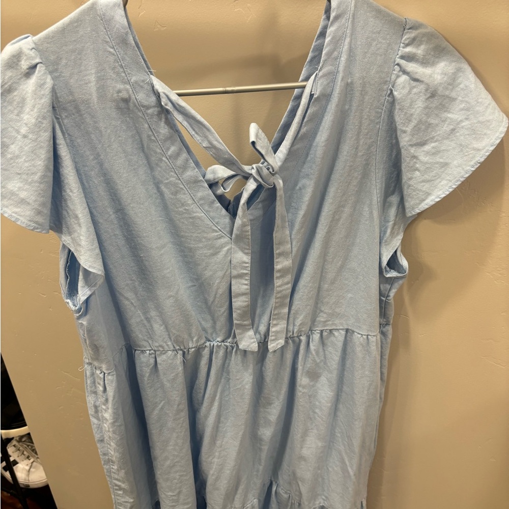 Cute blue dress with bow in the back.